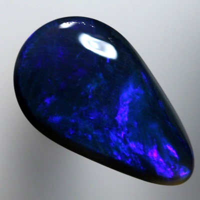 SOLID BLACK OPAL Royal blue moving in rollling flashes